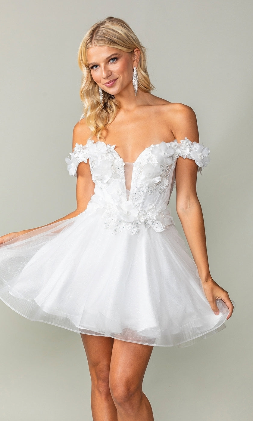 A woman poses against a plain light background wearing the Off-the-Shoulder Short Babydoll Hoco Dress 3344, featuring floral appliqués, a tulle skirt, and an off-the-shoulder neckline.